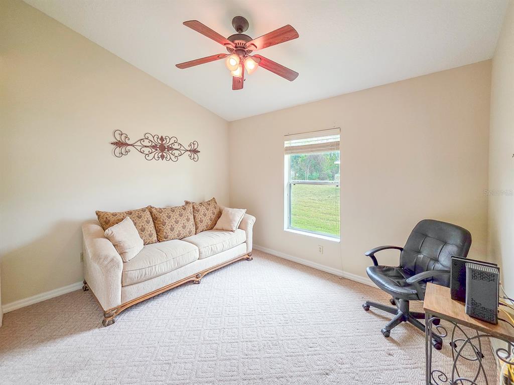 1 Ripley Place Palm Coast, FL 32164 - Photo 38 of 54 a living room with furniture and a window