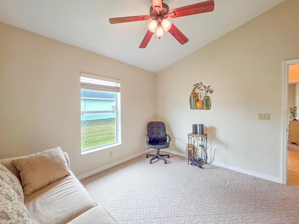 1 Ripley Place Palm Coast, FL 32164 - Photo 39 of 54 a living room with furniture and a window