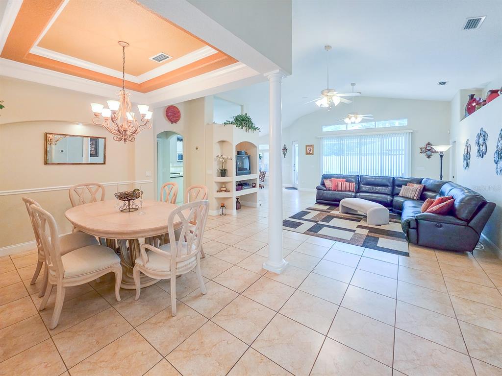 1 Ripley Place Palm Coast, FL 32164 - Photo 4 of 54 a living room with furniture and a chandelier