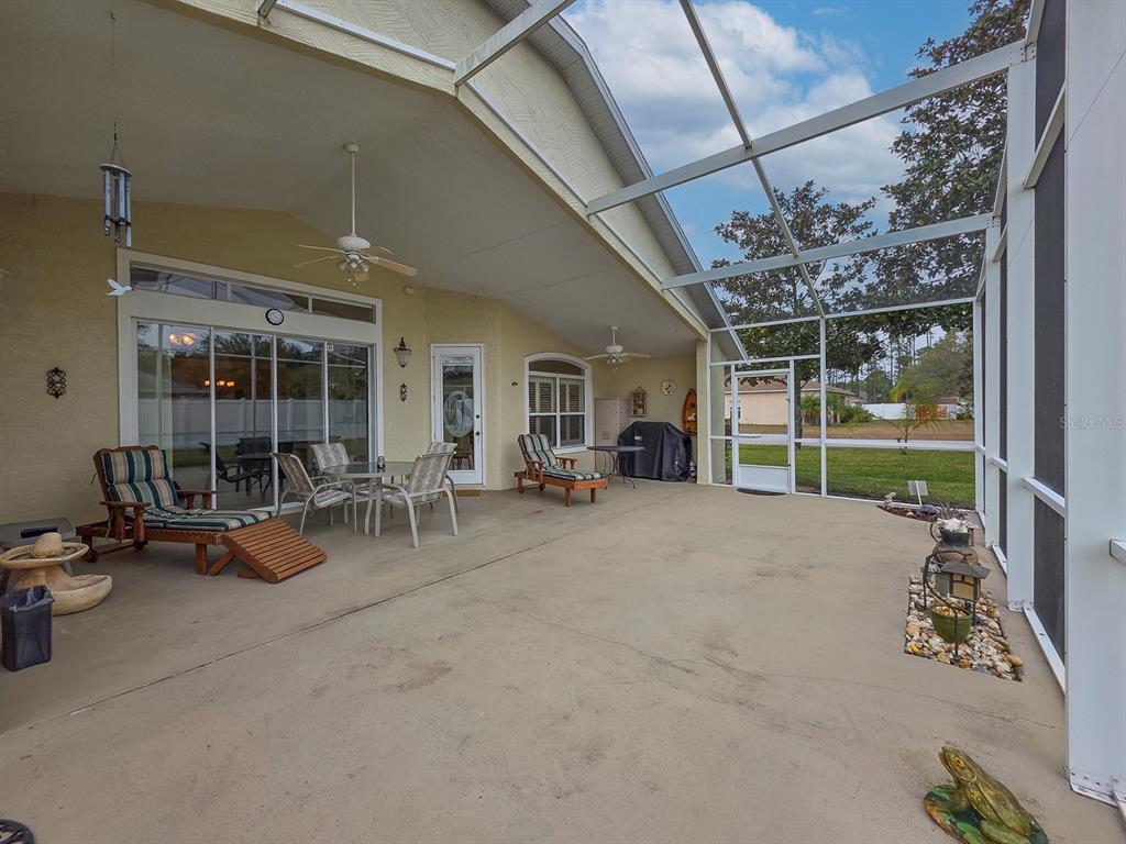 1 Ripley Place Palm Coast, FL 32164 - Photo 44 of 54 a view of a livingroom with furniture and a floor to ceiling window