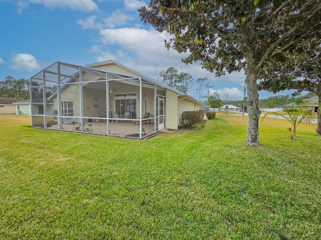 1 Ripley Place Palm Coast, FL 32164 - Photo 47 of 54 a view of a house with a yard and sitting area