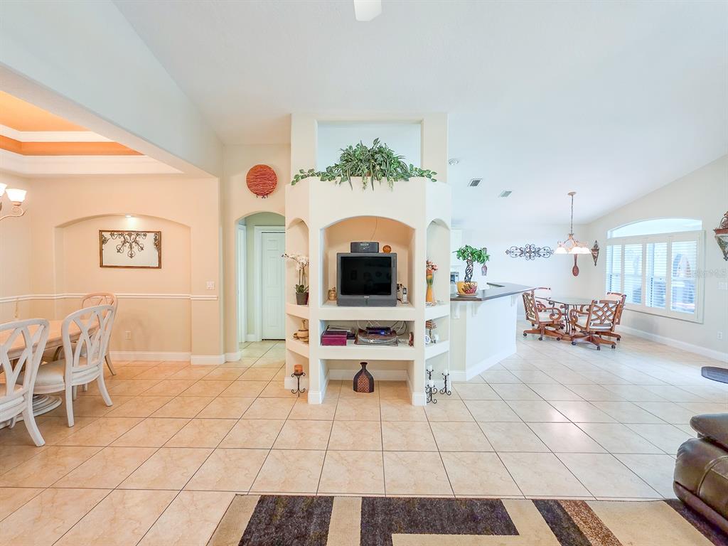 1 Ripley Place Palm Coast, FL 32164 - Photo 9 of 54 a bedroom with furniture and a fireplace