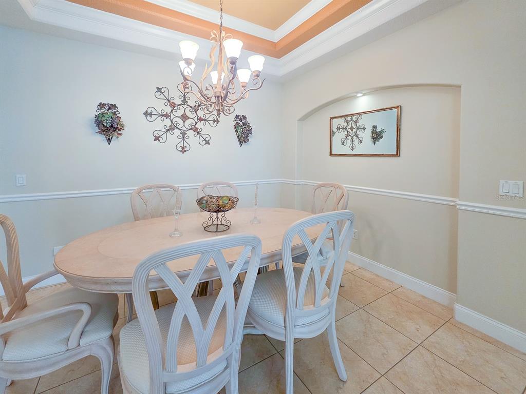 1 Ripley Place Palm Coast, FL 32164 - Photo 10 of 54 a dining room with furniture and chandelier
