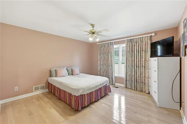 a living room with furniture garden view and a large window