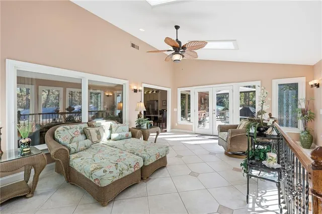 a spacious bedroom with a bed and a large window