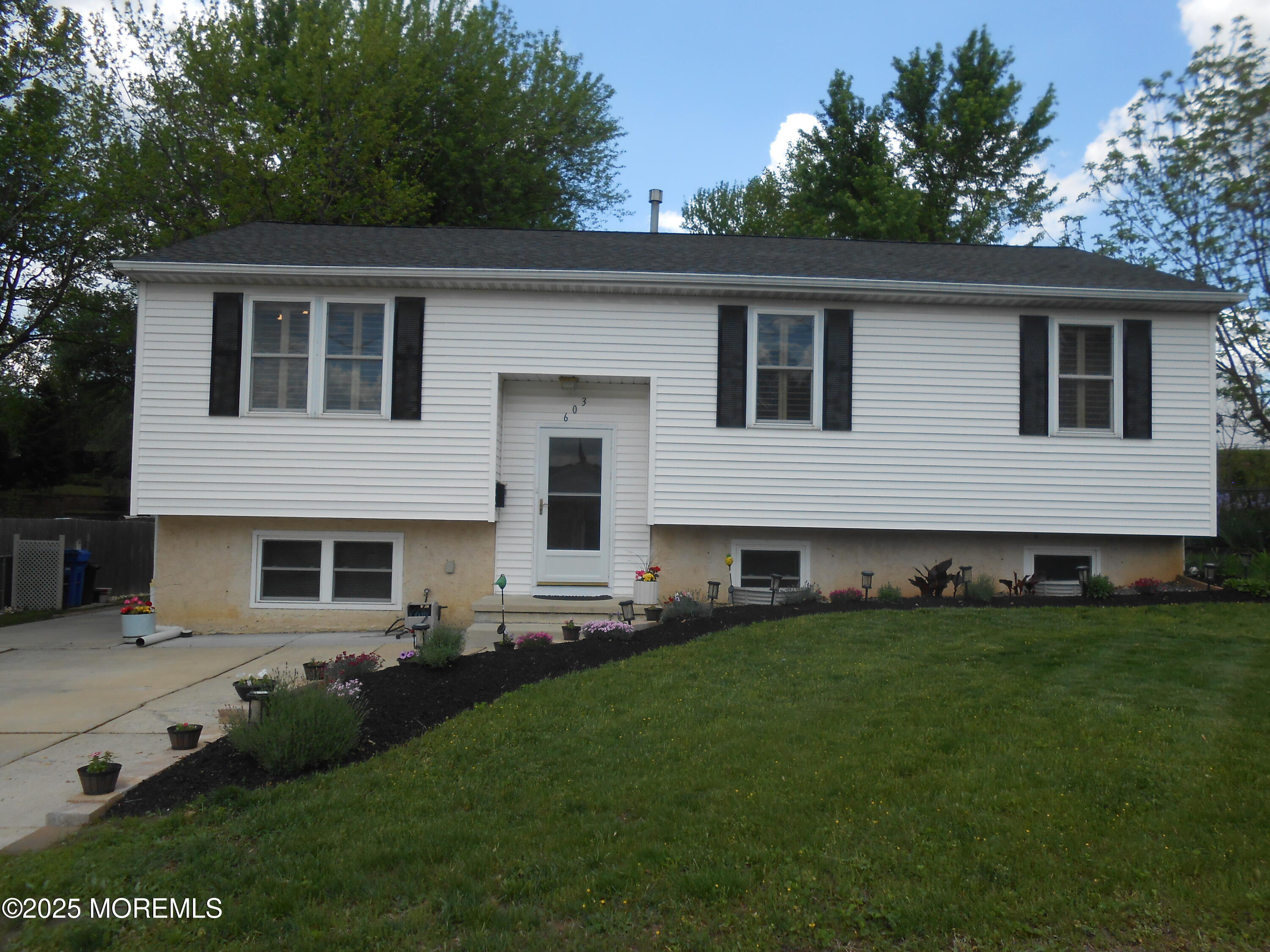 a house view with a garden space