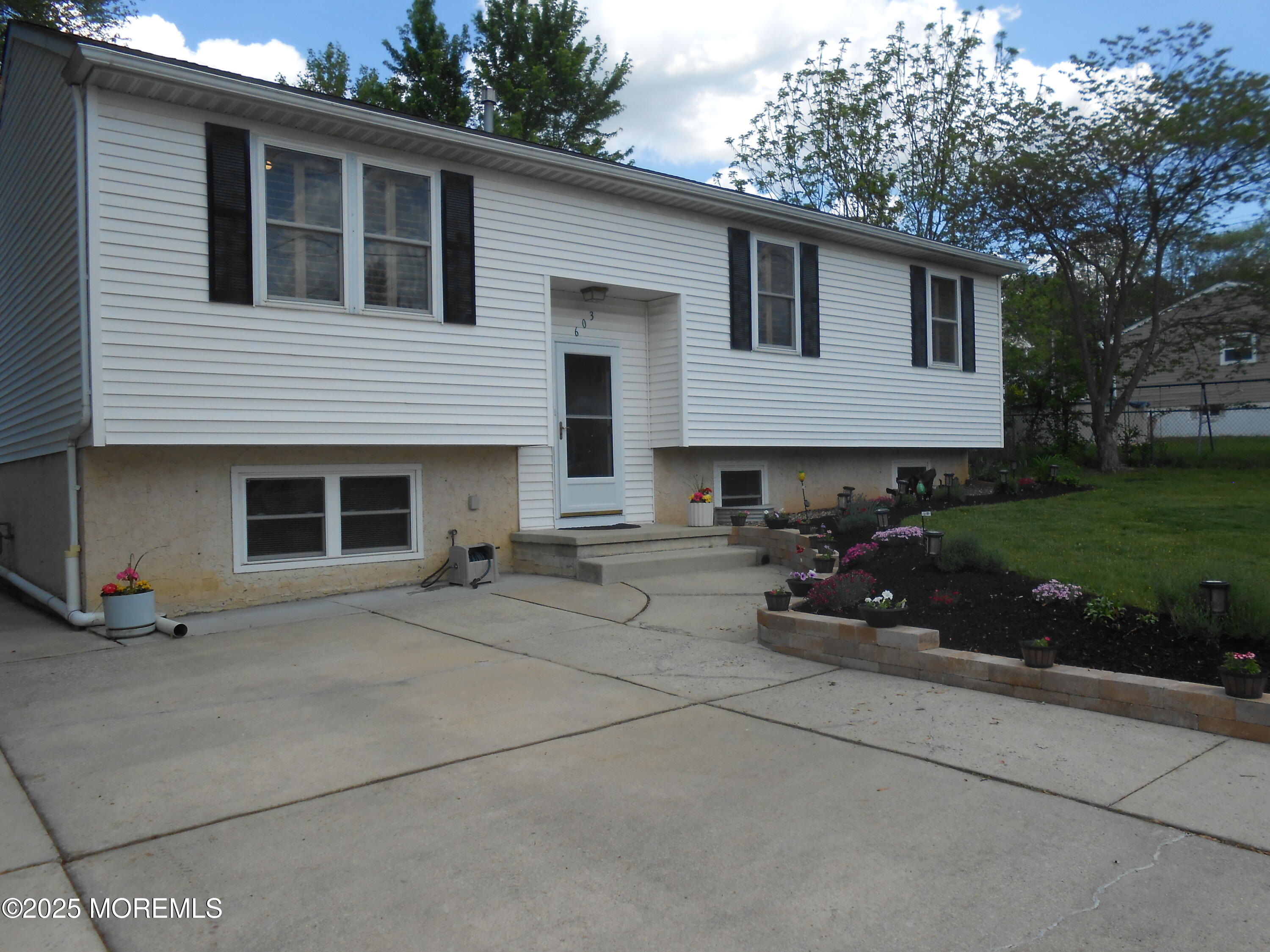 603 Bloomfield Drive Westampton, NJ 08060 - Photo 3 of 66 a view of a house with a yard and a garage