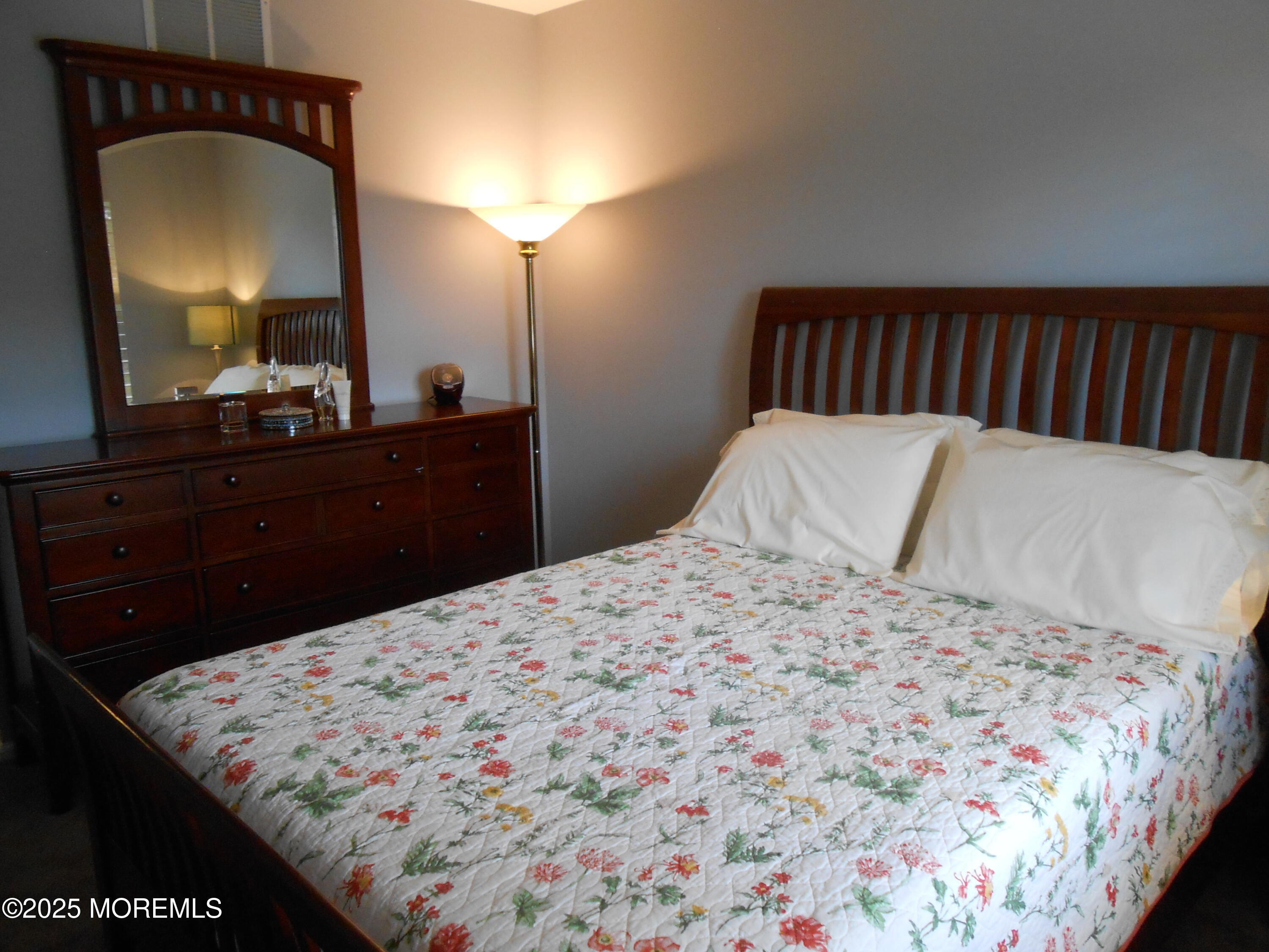 603 Bloomfield Drive Westampton, NJ 08060 - Photo 45 of 66 a bedroom with a bed and a mirror on dresser
