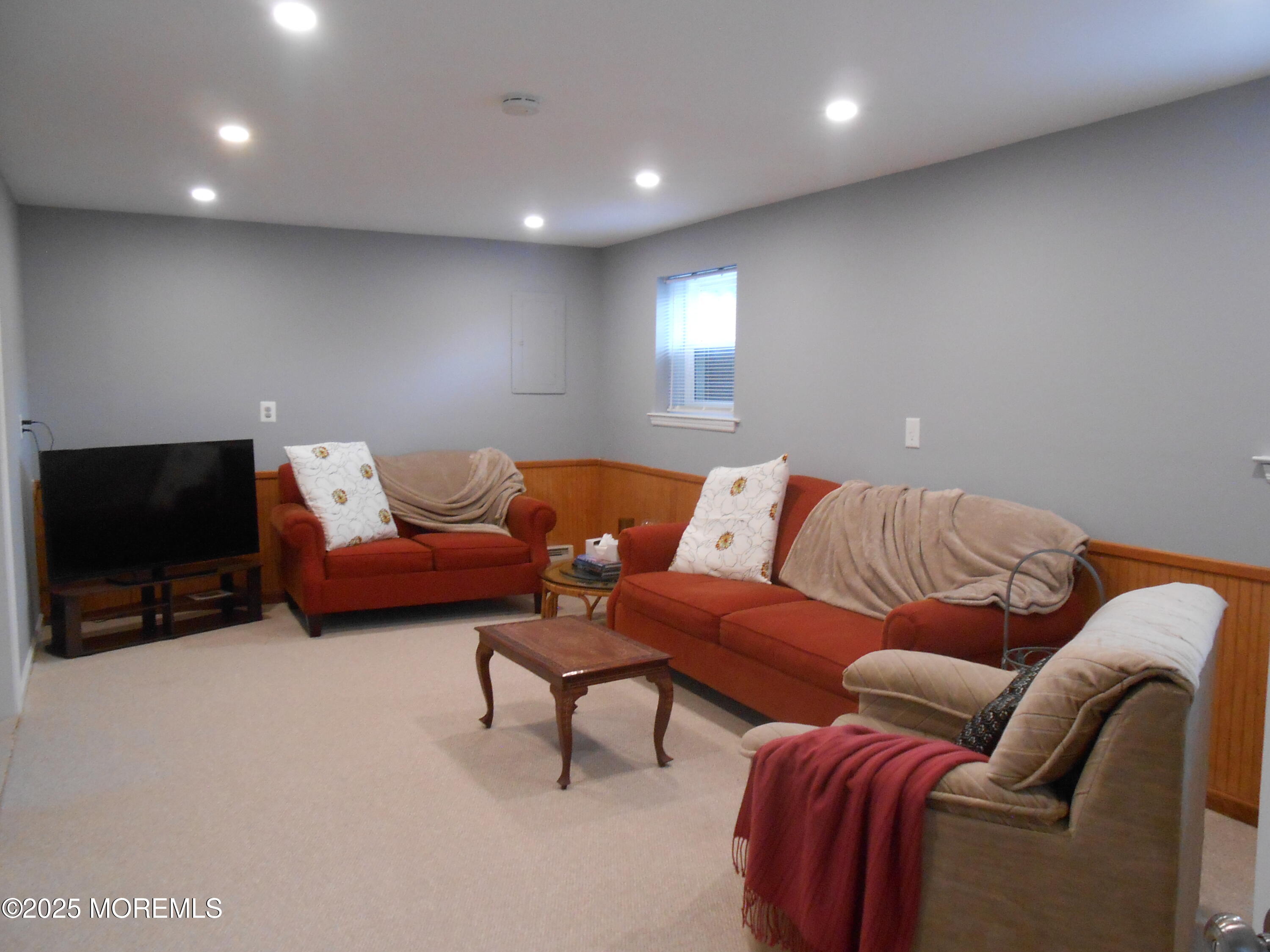 603 Bloomfield Drive Westampton, NJ 08060 - Photo 49 of 66 a living room with furniture and a flat screen tv