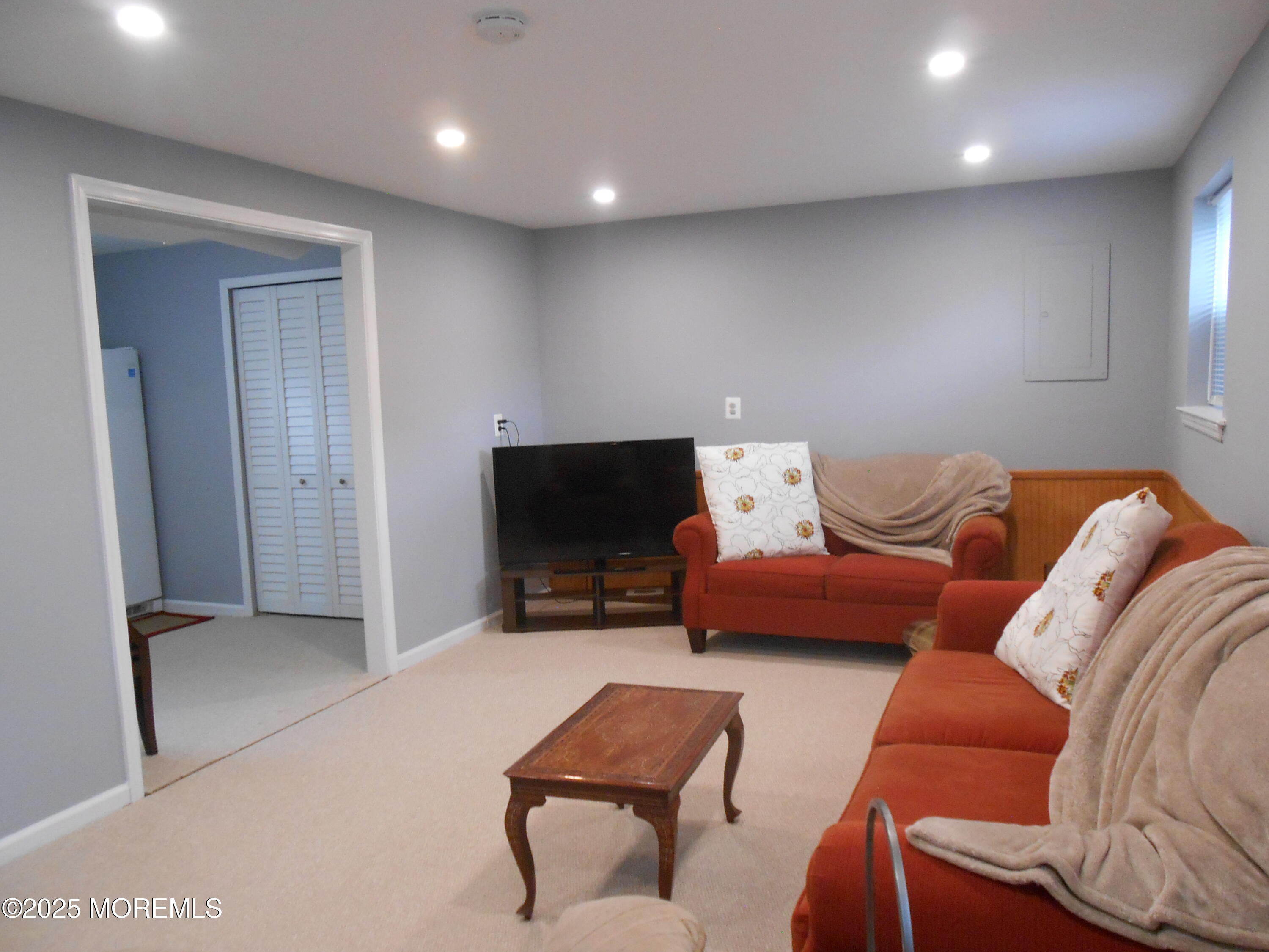 603 Bloomfield Drive Westampton, NJ 08060 - Photo 50 of 66 a living room with furniture and a flat screen tv