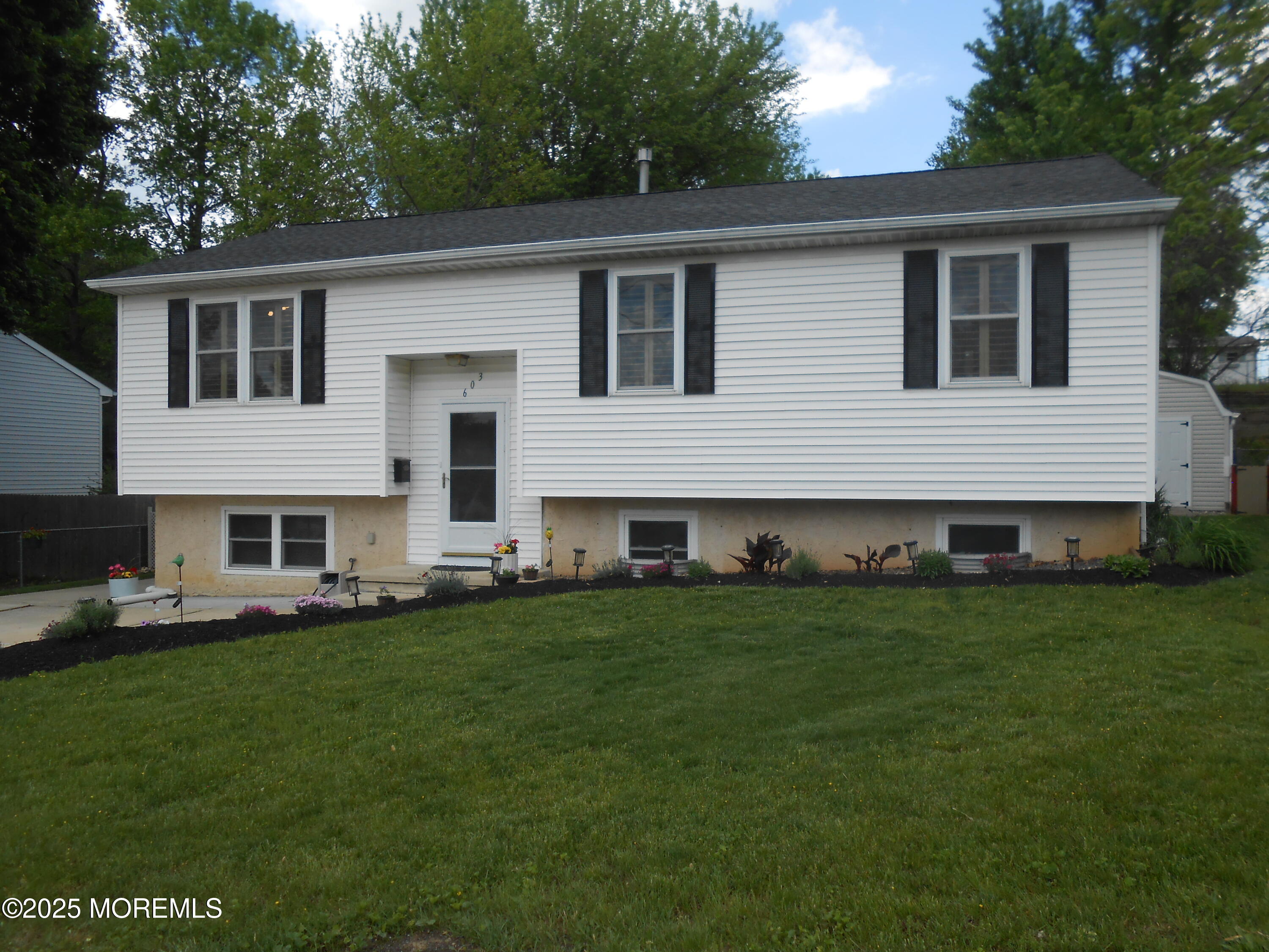 603 Bloomfield Drive Westampton, NJ 08060 - Photo 5 of 66 a front view of house with yard and green space