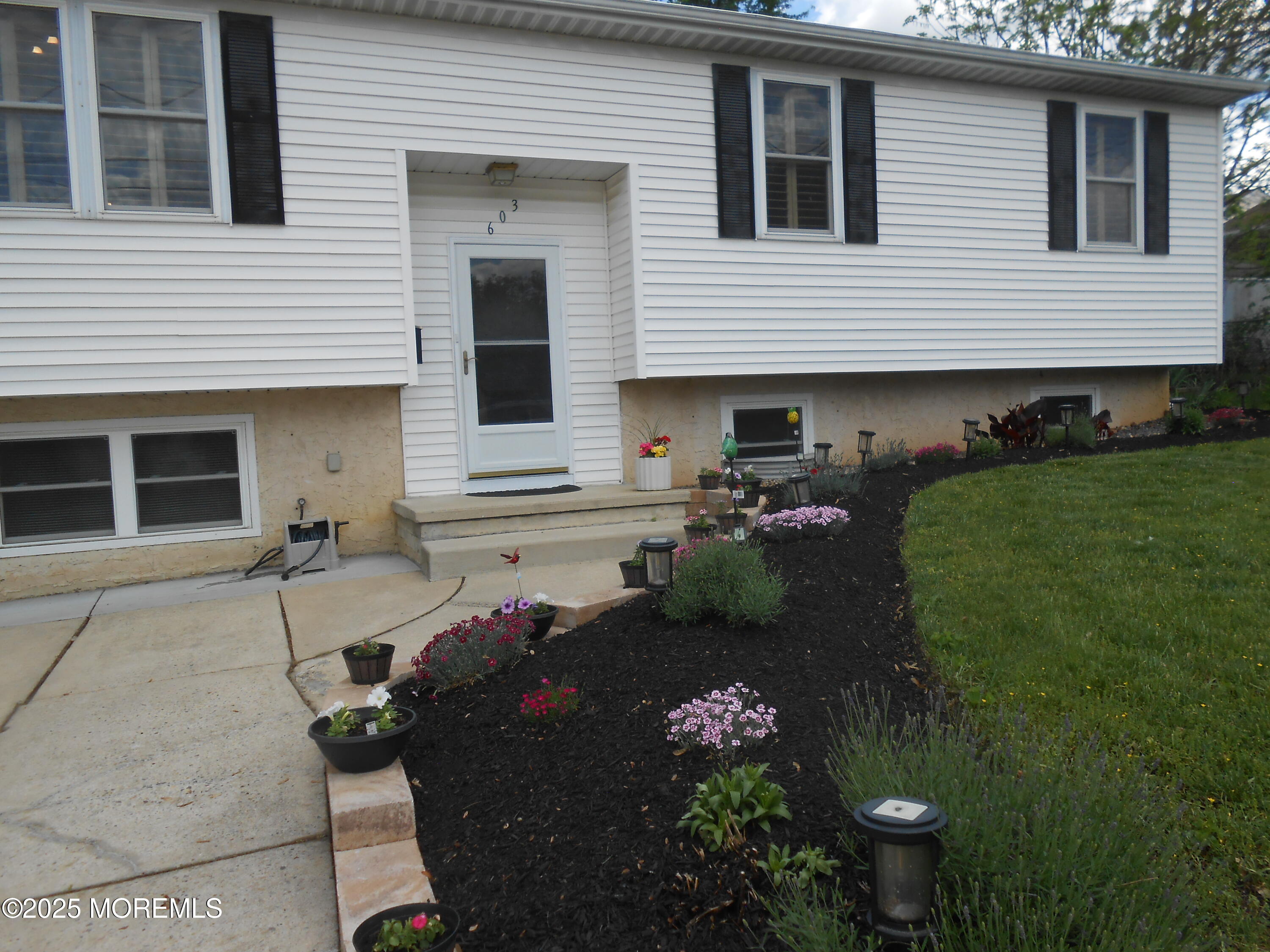 603 Bloomfield Drive Westampton, NJ 08060 - Photo 8 of 66 a front view of a house with a garden