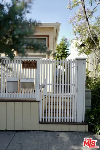 a view of a brick house with a large window