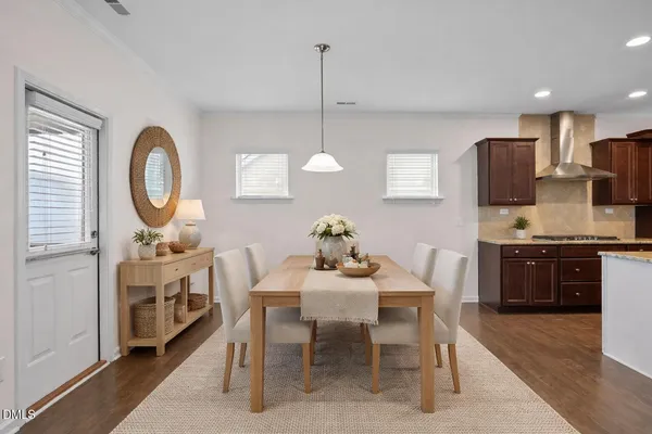 a bedroom with a large bed and a potted plant