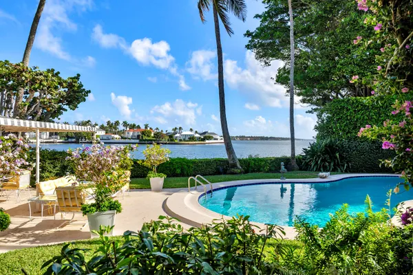 a view of a swimming pool with a patio