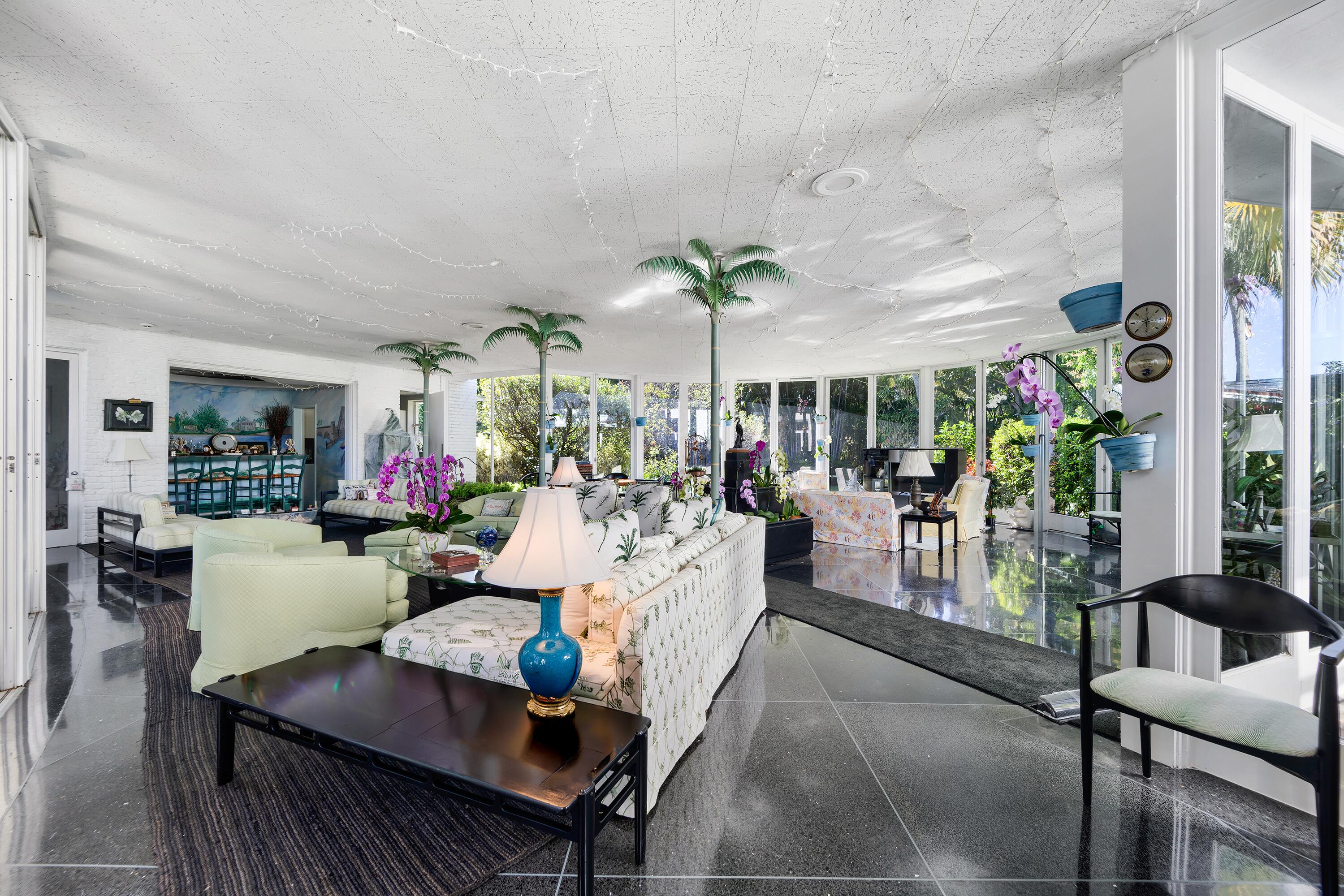 350 Island Road Palm Beach, FL 33480 - Photo 15 of 26 a living room with furniture potted plant and a large window