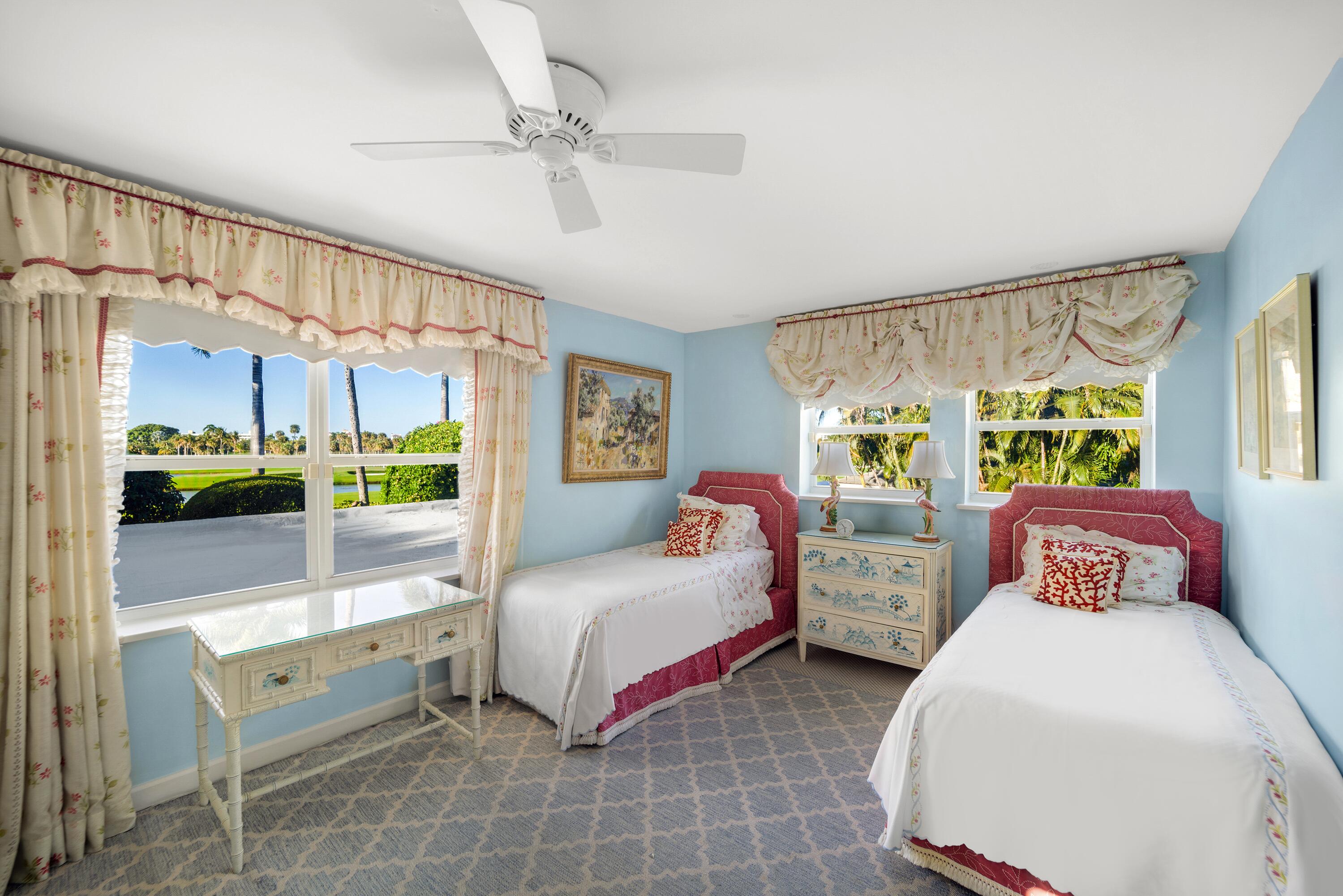 350 Island Road Palm Beach, FL 33480 - Photo 20 of 26 a bedroom with two beds and large window