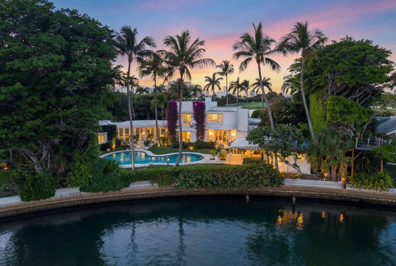 350 Island Road Palm Beach, FL 33480 - Photo 3 of 26 a view of swimming pool with a table and chairs