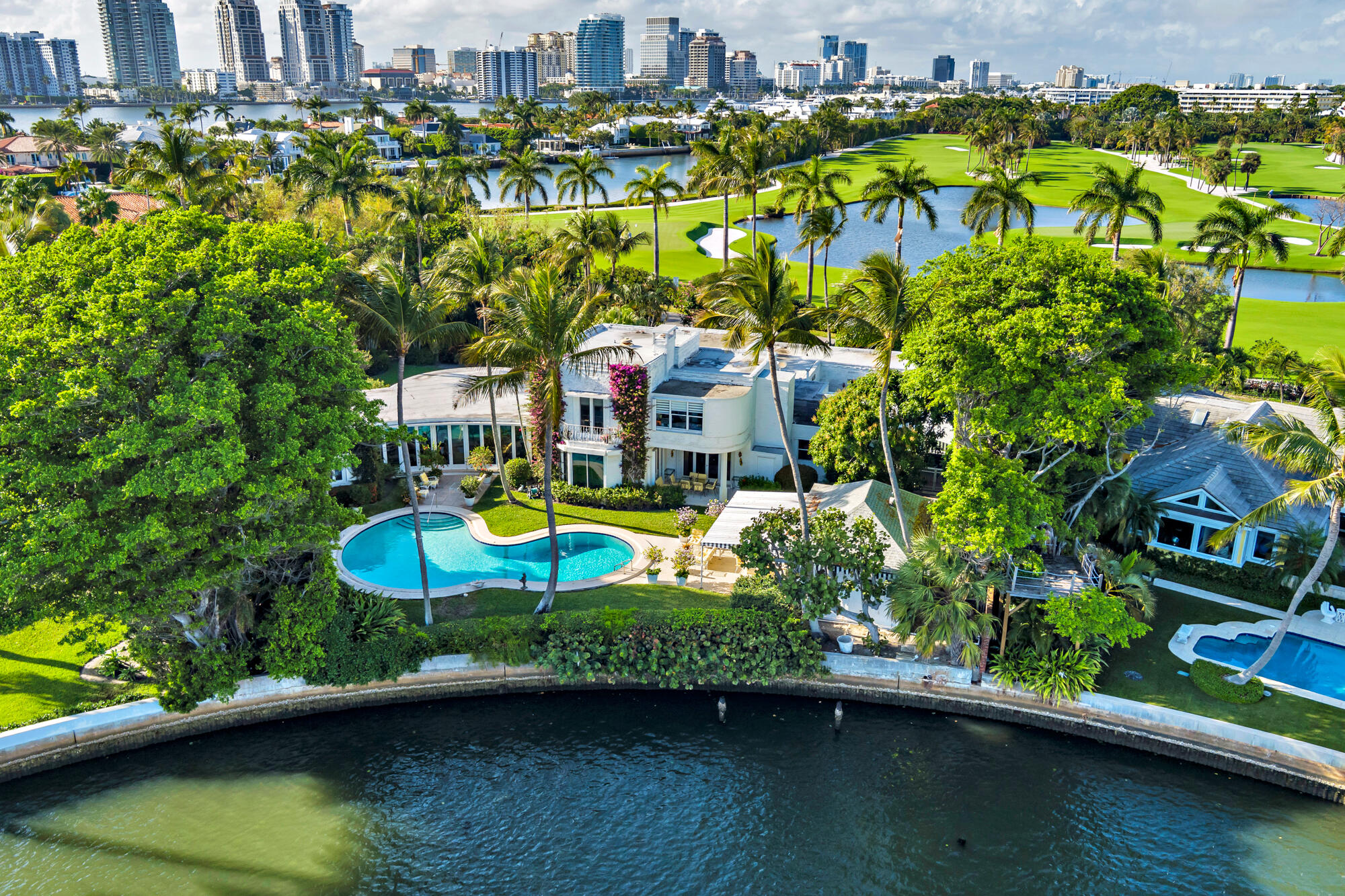 350 Island Road Palm Beach, FL 33480 - Photo 4 of 26 a view of a swimming pool with a yard