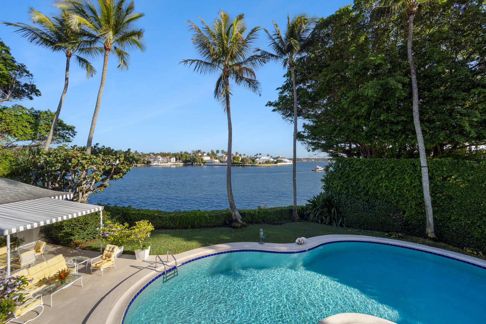 350 Island Road Palm Beach, FL 33480 - Photo 5 of 26 a view of a house with pool and a yard