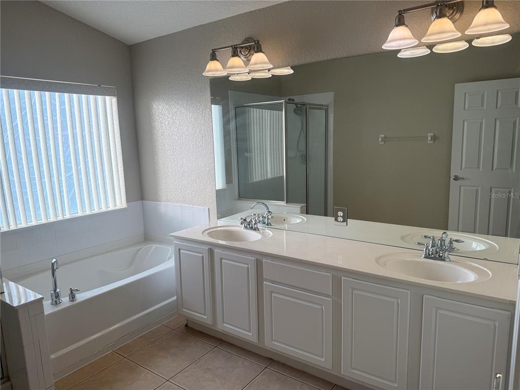 1100 Brant Point Orlando, FL 32828 - Photo 10 of 26 a bathroom with a sink and a mirror