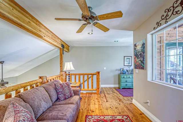 a living room with furniture and a rug