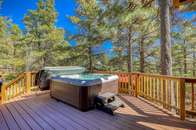 a view of balcony with wooden floor and outdoor seating