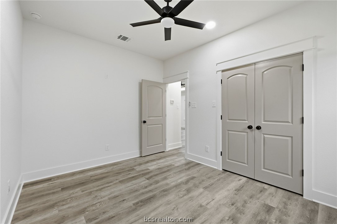 205 Lock Lane Bryan, TX 77803 - Photo 16 of 23 a view of a livingroom with a ceiling fan & a ceiling fan