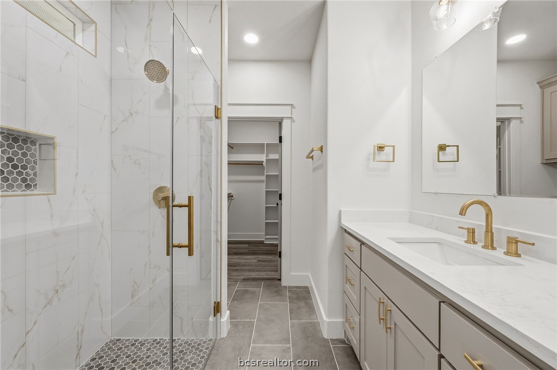 205 Lock Lane Bryan, TX 77803 - Photo 19 of 23 a bathroom with a sink and a shower