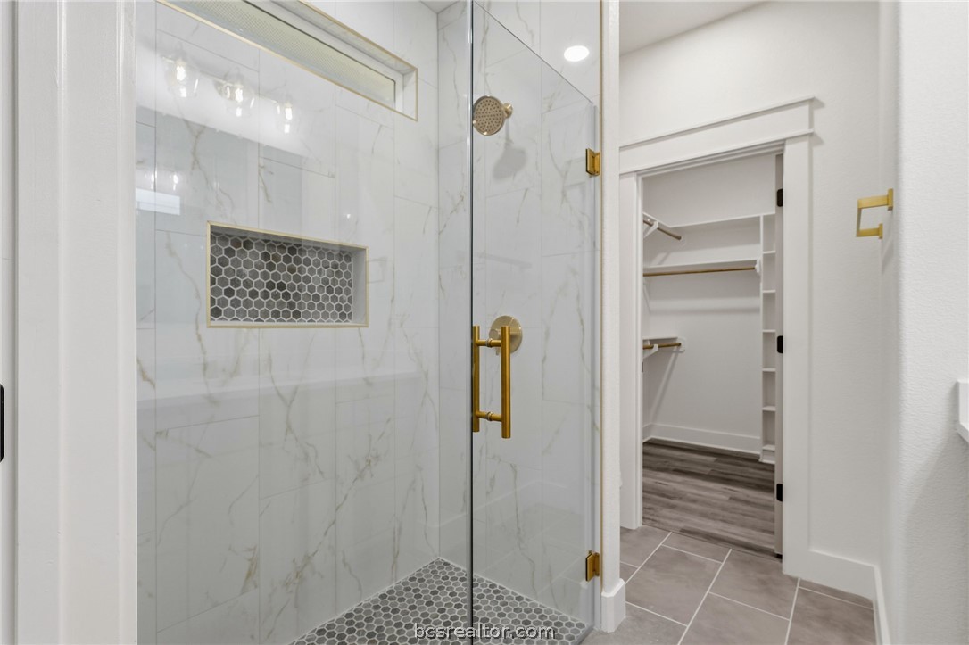 205 Lock Lane Bryan, TX 77803 - Photo 20 of 23 a bathroom with a shower