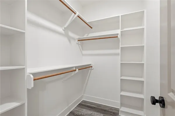 a view of an empty walk in closet