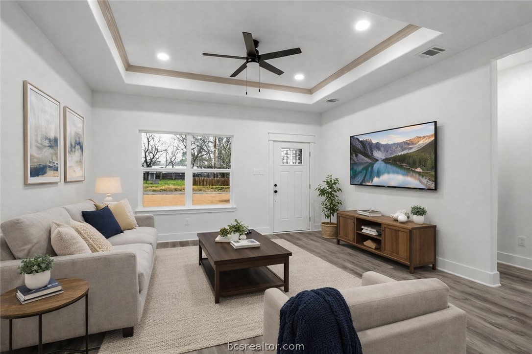 205 Lock Lane Bryan, TX 77803 - Photo 5 of 23 a living room with furniture and a flat screen tv