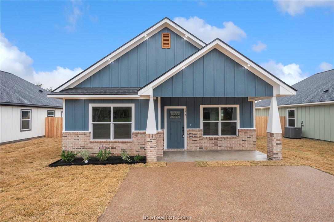 205 Lock Lane Bryan, TX 77803 - Photo 7 of 23 a front view of house with yard and outdoor space