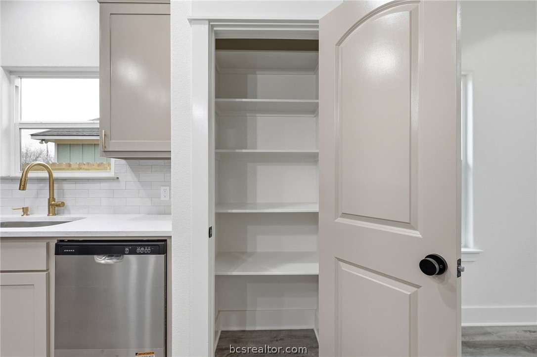 205 Lock Lane Bryan, TX 77803 - Photo 10 of 23 a bathroom with a sink and a mirror