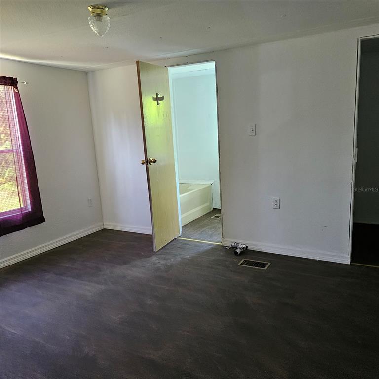 2603 Ince Drive Ruskin, FL 33570 - Photo 5 of 10 an empty room with windows