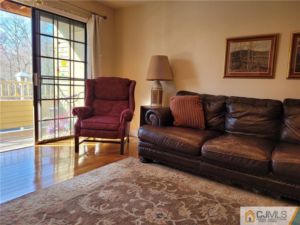 2705 Ridgefield Court, Unit 2705 Helmetta, NJ 08828 - Photo 11 of 33 a living room with furniture and a window
