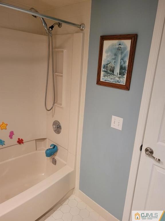 2705 Ridgefield Court, Unit 2705 Helmetta, NJ 08828 - Photo 16 of 33 a bathroom with a shower and a bath tub