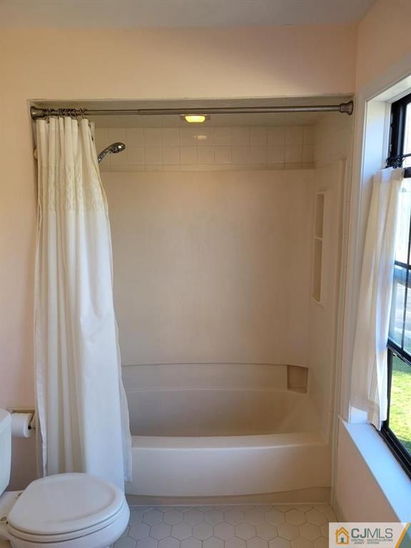 2705 Ridgefield Court, Unit 2705 Helmetta, NJ 08828 - Photo 21 of 33 a bathroom with a shower and a toilet
