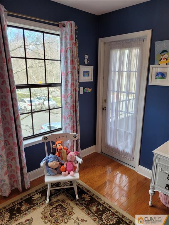 2705 Ridgefield Court, Unit 2705 Helmetta, NJ 08828 - Photo 24 of 33 a outdoor living room with furniture and a window
