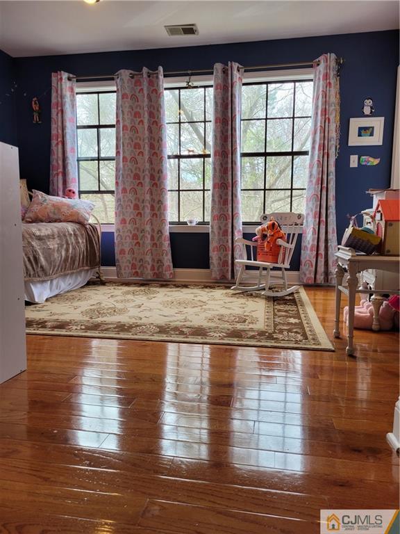 2705 Ridgefield Court, Unit 2705 Helmetta, NJ 08828 - Photo 25 of 33 a living room with furniture window and wooden floor