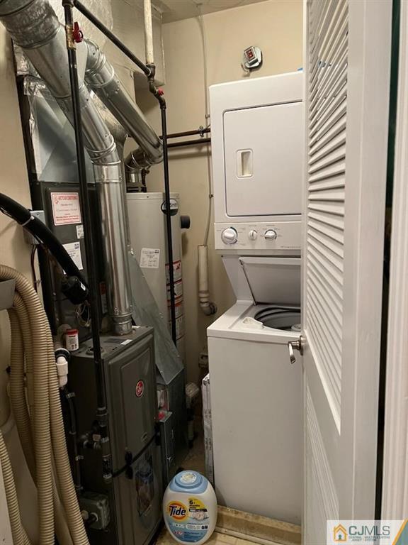2705 Ridgefield Court, Unit 2705 Helmetta, NJ 08828 - Photo 31 of 33 a utility room with dryer and washer