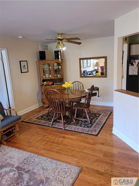 2705 Ridgefield Court, Unit 2705 Helmetta, NJ 08828 - Photo 8 of 33 a view of a dining room with furniture
