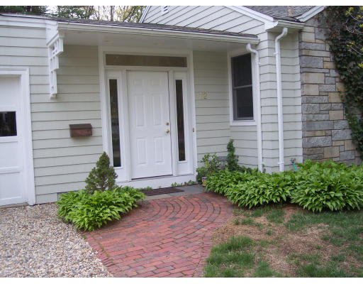 72 Fox Run Road Hamilton, MA 01982 - Photo 2 of 8 a front view of a house with garden