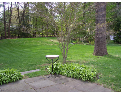 72 Fox Run Road Hamilton, MA 01982 - Photo 7 of 8 a view of a garden with a bench in a garden