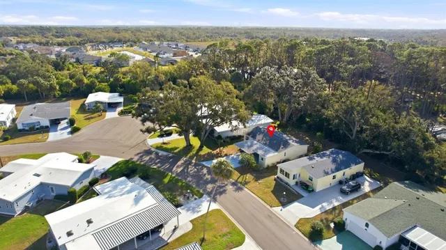 an aerial view of a house with a lake view