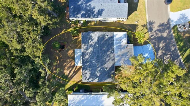 a view of a yard with a tree