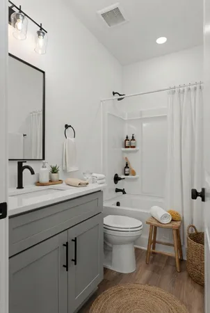 a view of a livingroom with furniture and hardwood floor