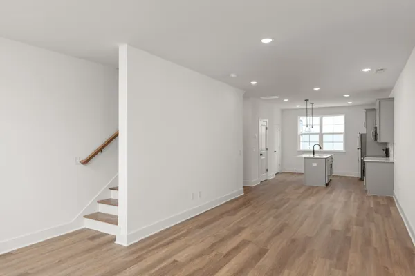 a bedroom with bed and wooden floor