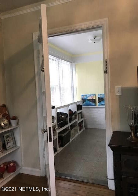 1677 Geraldine Drive Jacksonville, FL 32205 - Photo 11 of 52 a kitchen with stainless steel appliances wooden floor and a sink