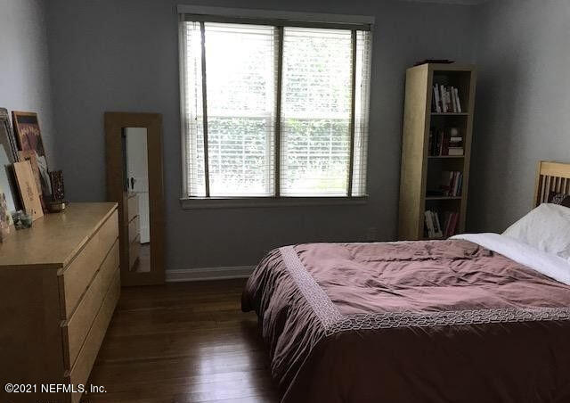 1677 Geraldine Drive Jacksonville, FL 32205 - Photo 26 of 52 a bedroom with a bed and wooden floor
